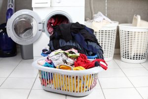 A pile of clothes in a Laundry basket